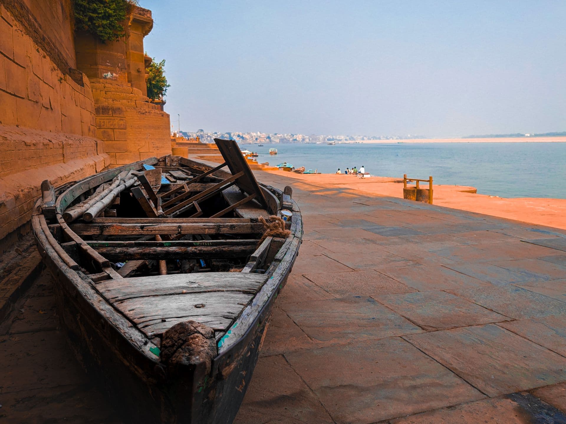 A wooden boat on a quiet Varanasi ghat